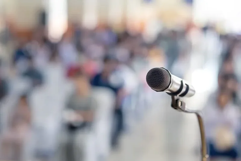 Researchers presenting and discussing work at an international conference