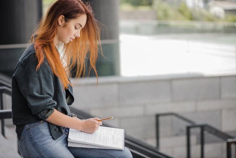 female student writing