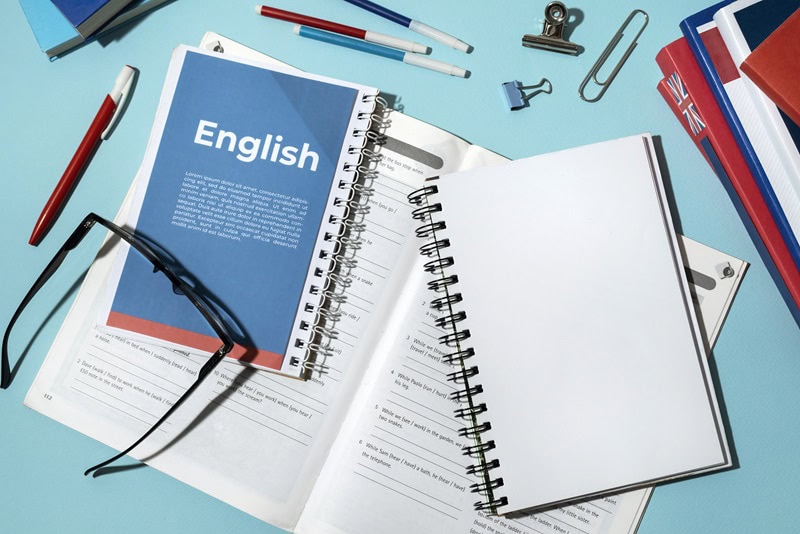 english books sprawled on table